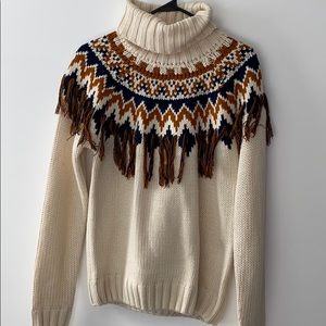 multi tasseled turtleneck